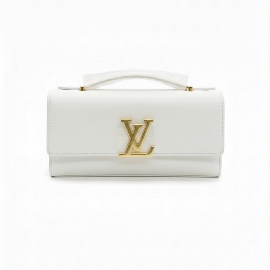 White handbag with gold accents on a white background