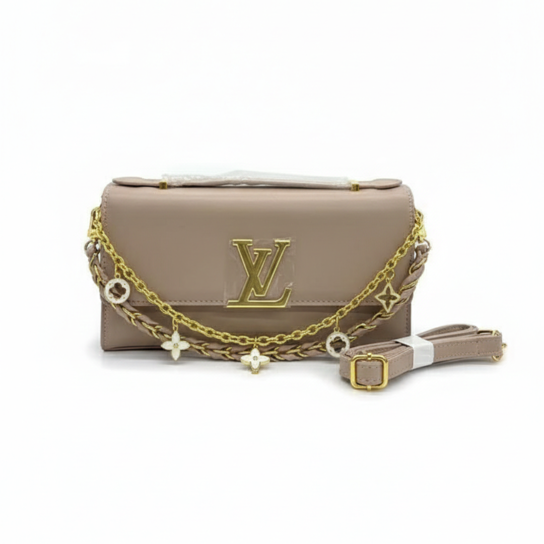 Beige handbag with gold chain and logo on a white background