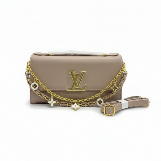 Beige handbag with gold chain and logo on a white background