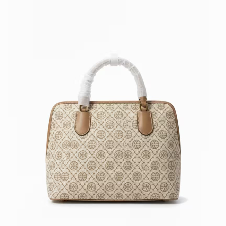 The T Burch Jacquard Swing Satchel.