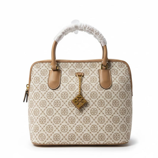 The T Burch Jacquard Swing Satchel.