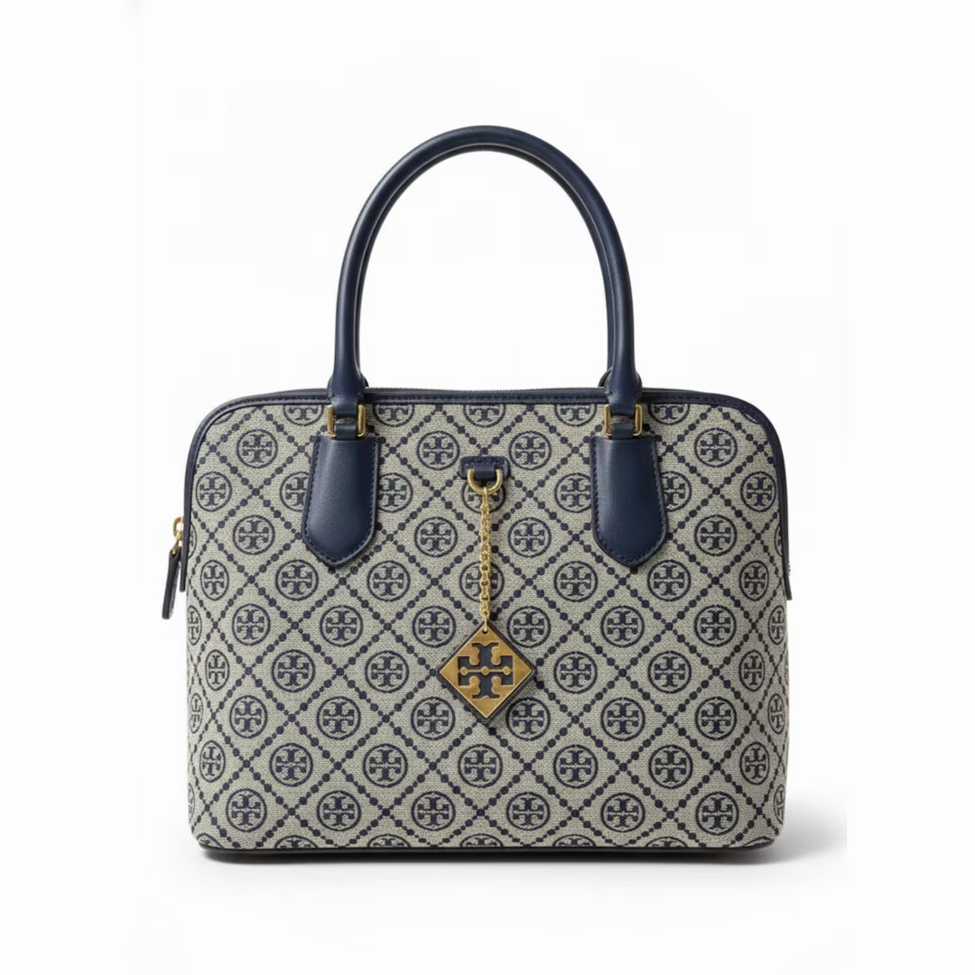 The T Burch Jacquard Swing Satchel.